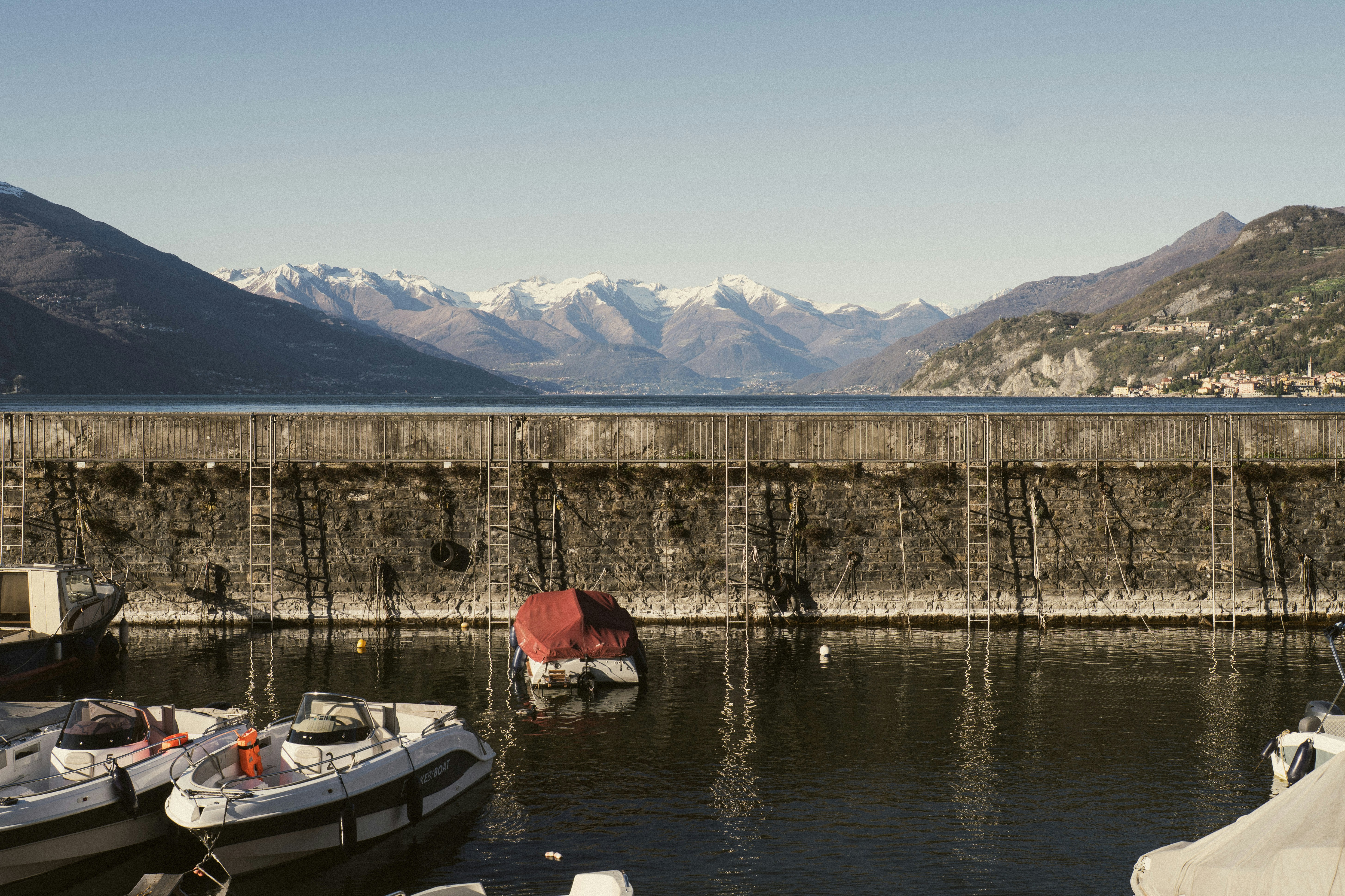 A scenic view of boats and mountains