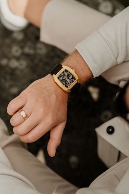 A man displays his luxury watch.
