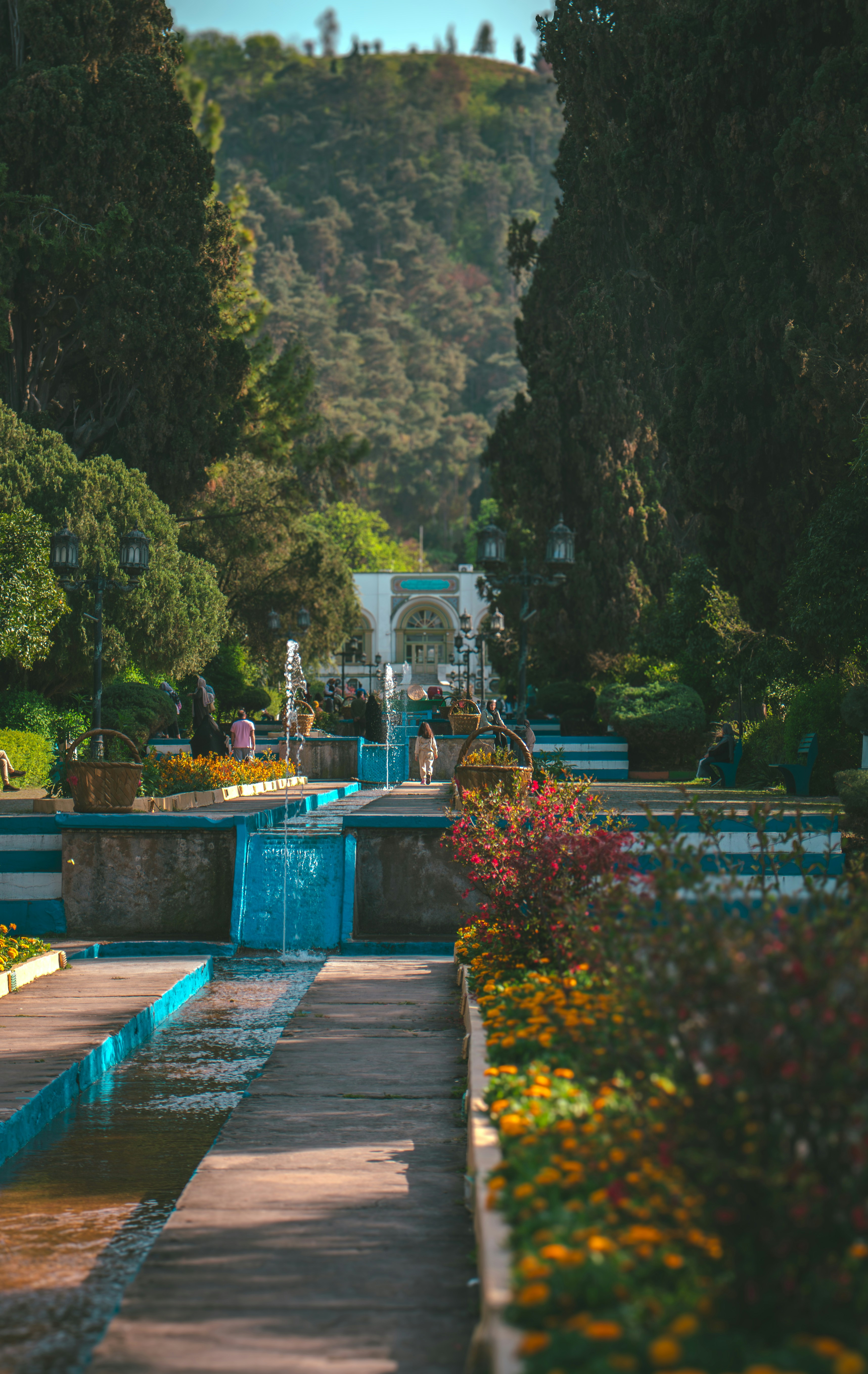 Beautiful park with water fountains and lush greenery.