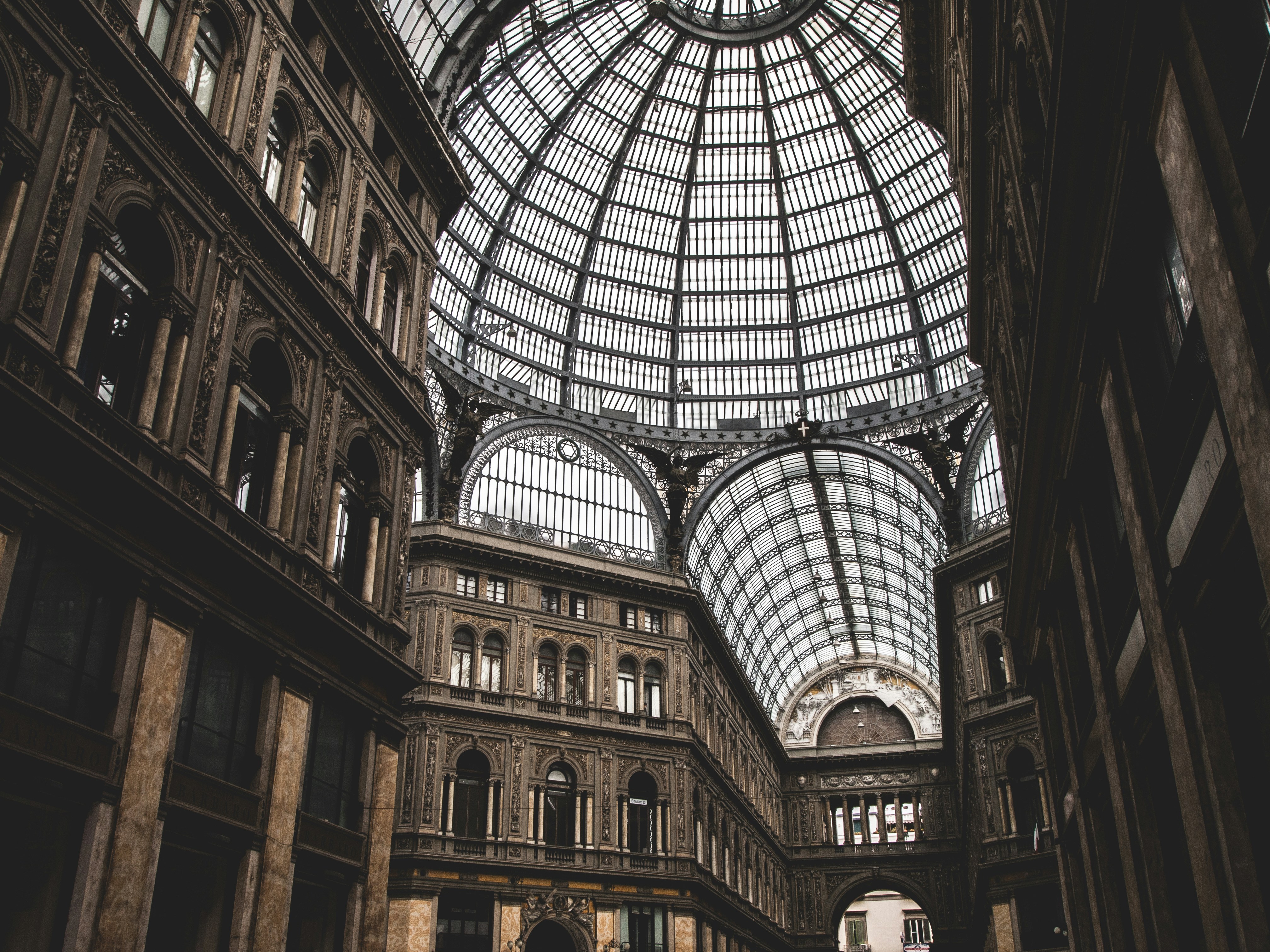 A grand glass dome adorns an elegant building.