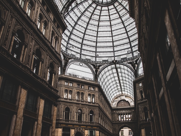 A grand glass dome adorns an elegant building.