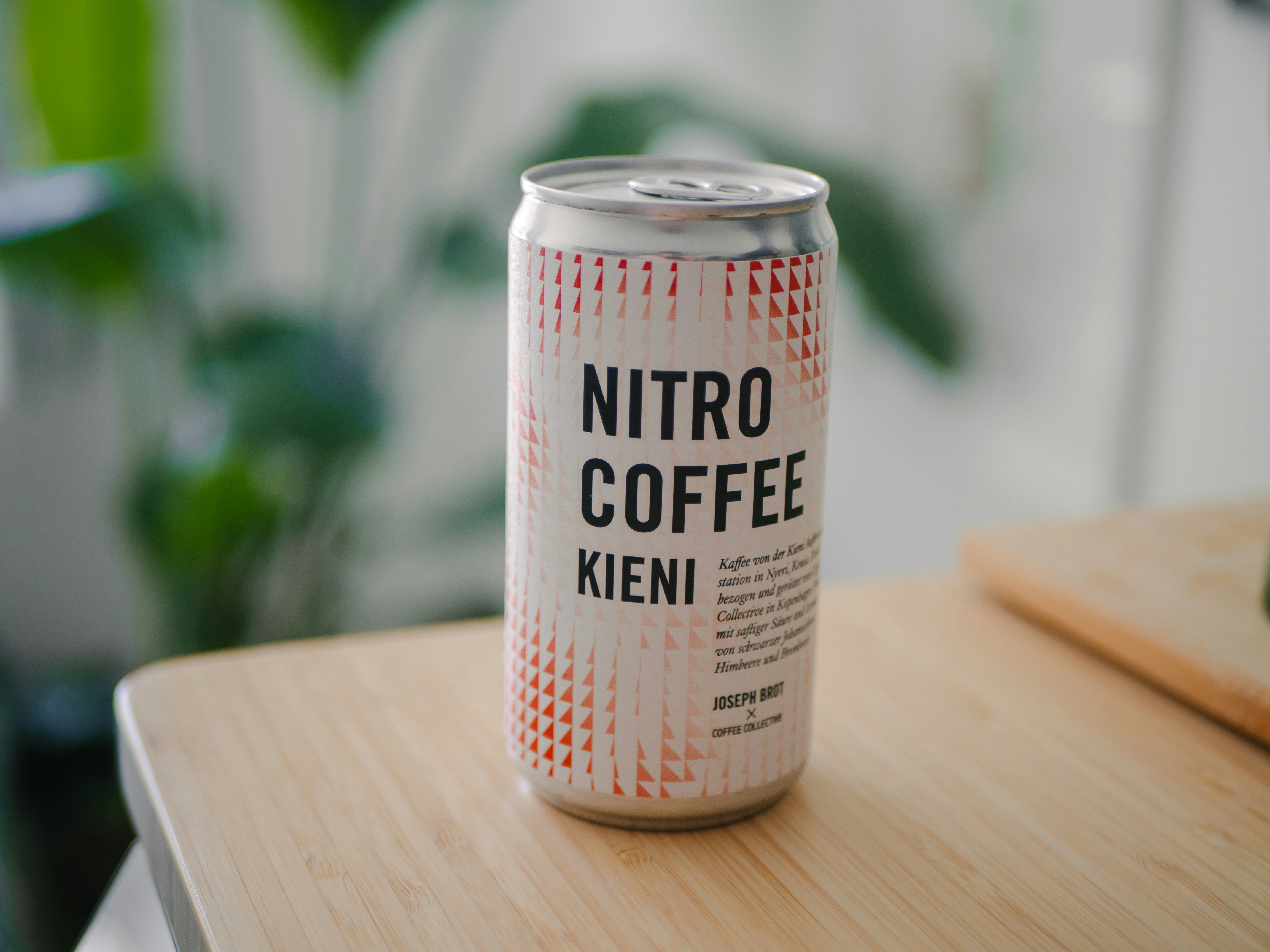 A can of nitro coffee sits on a table.