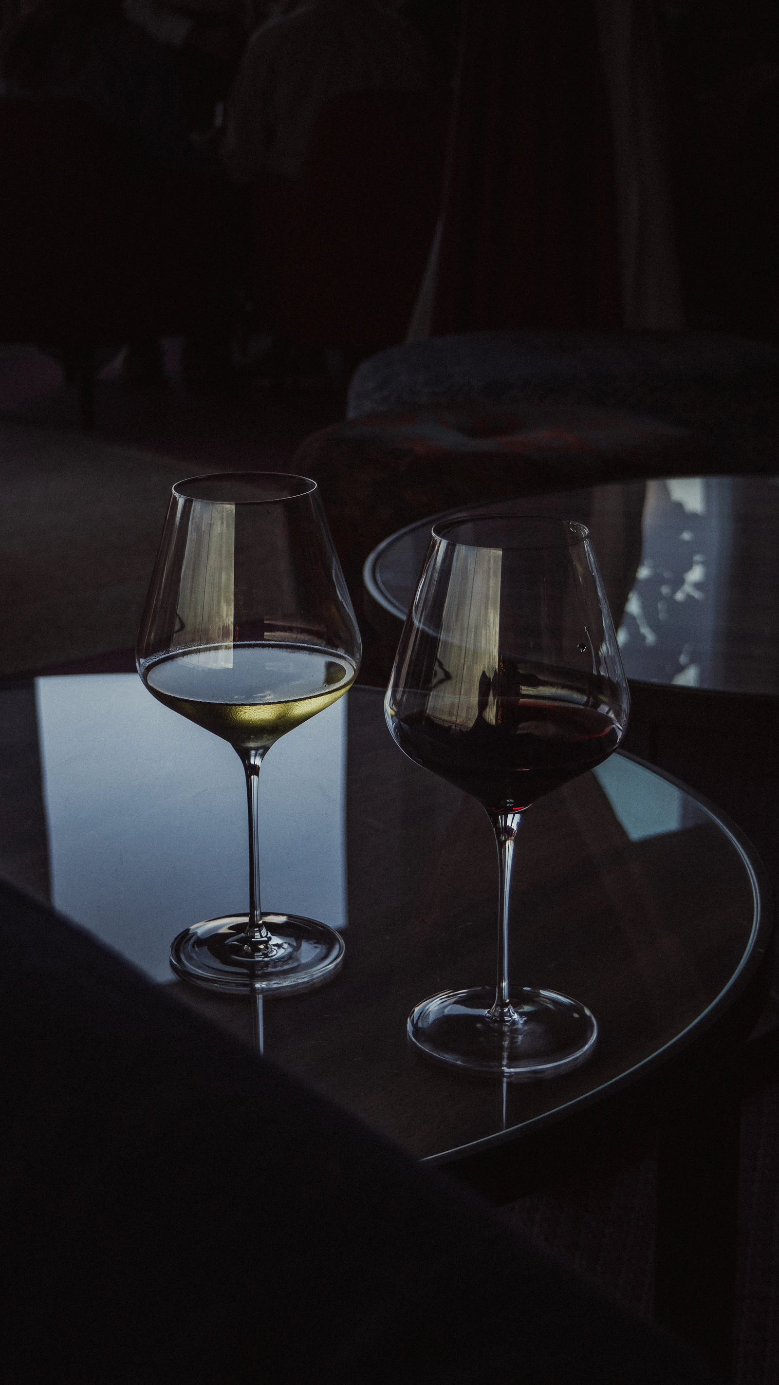Two glasses of wine on a table