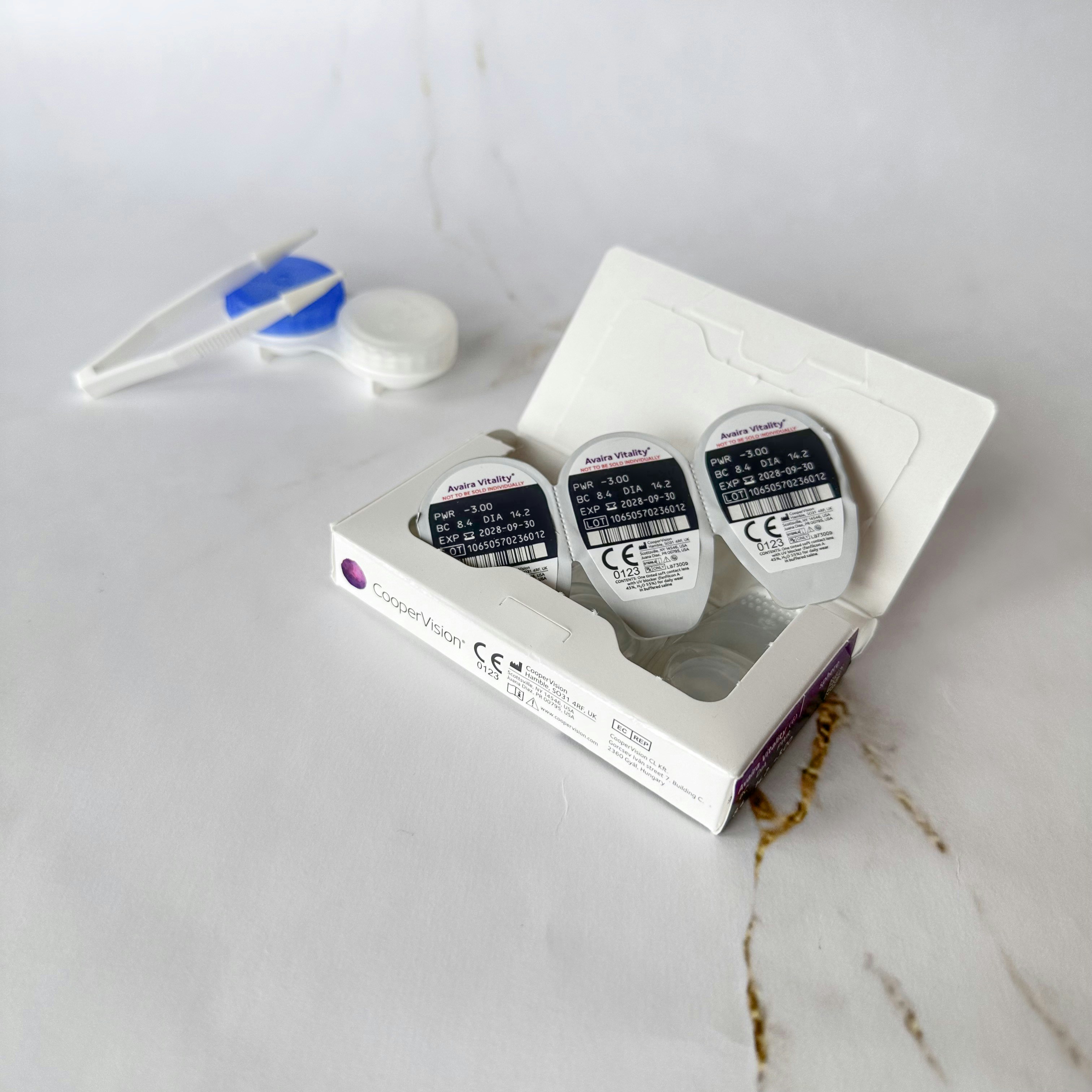 Contact lenses and their accessories are displayed.