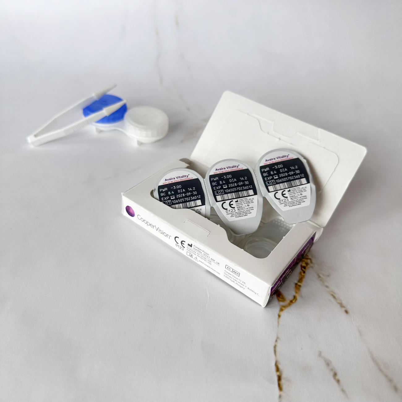 Contact lens packaging and lens case on a clean desk