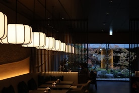A restaurant's interior with hanging lights.