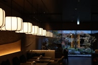 A restaurant's interior with hanging lights.