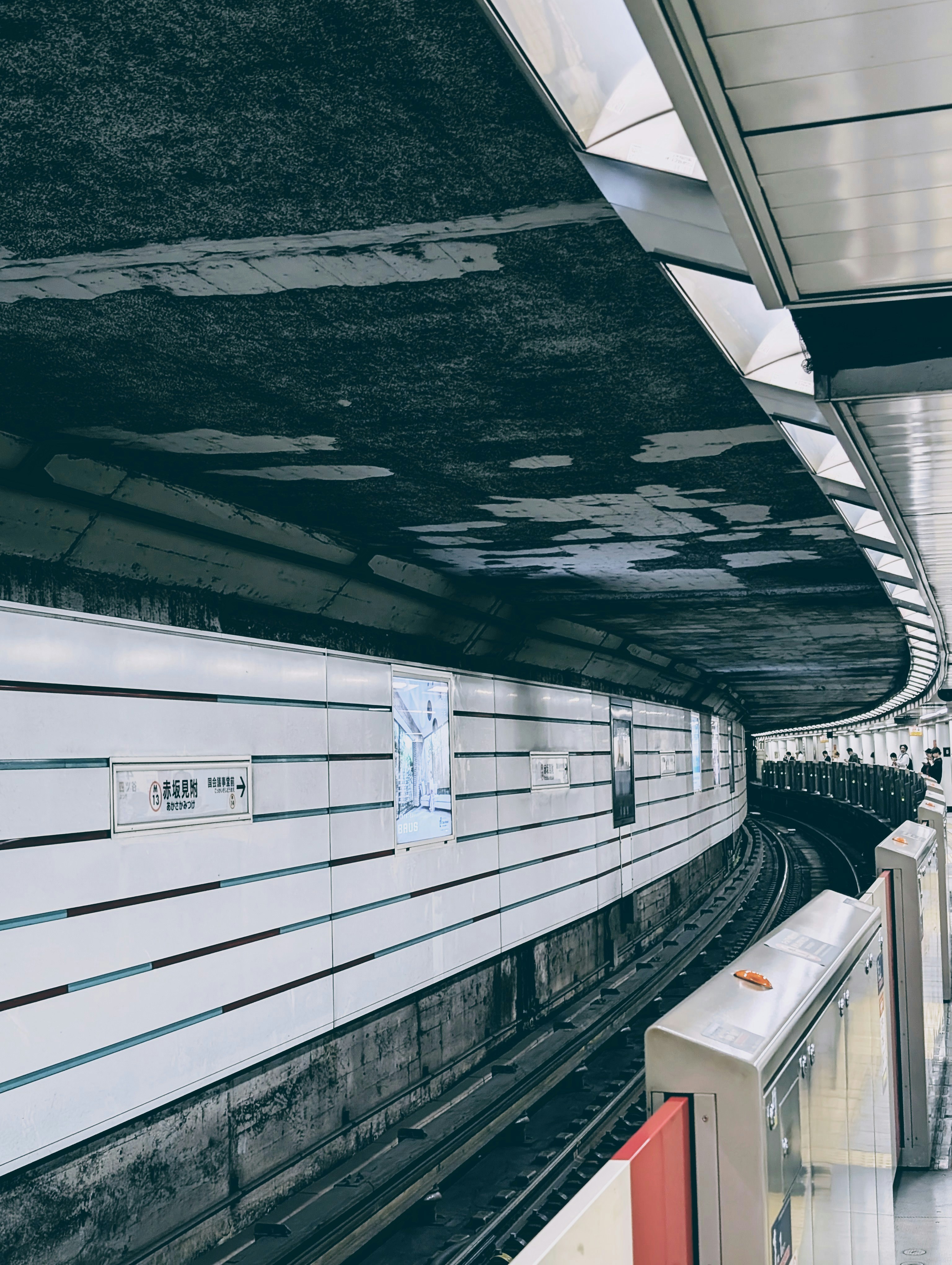 Subway tunnel featuring tracks and walls