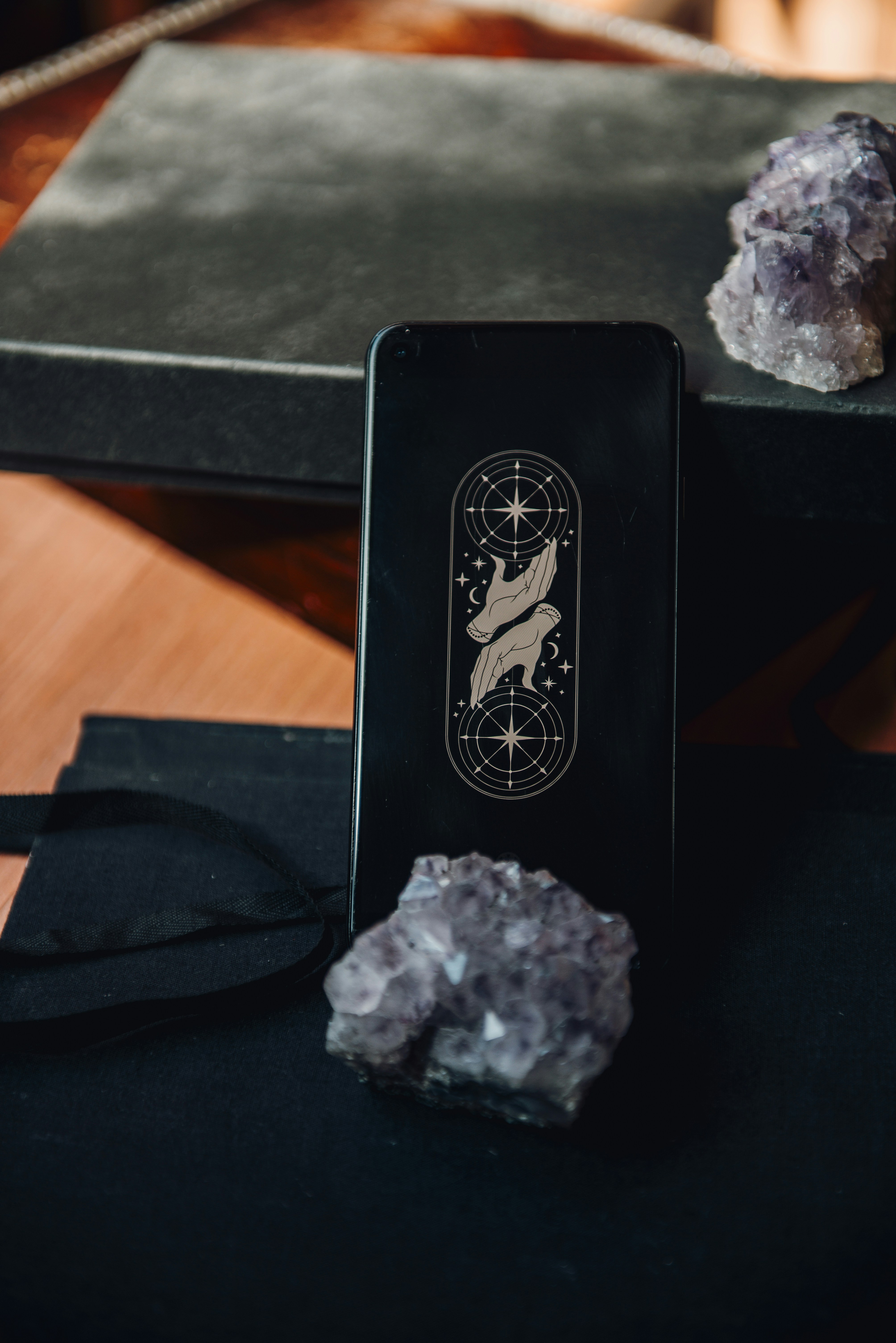 Tarot card deck, crystals, and books.
