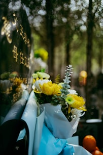 Flowers rest at a graveside memorial.
