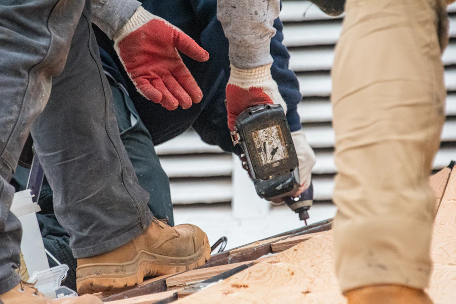 Roofing crew members working on a residential roof