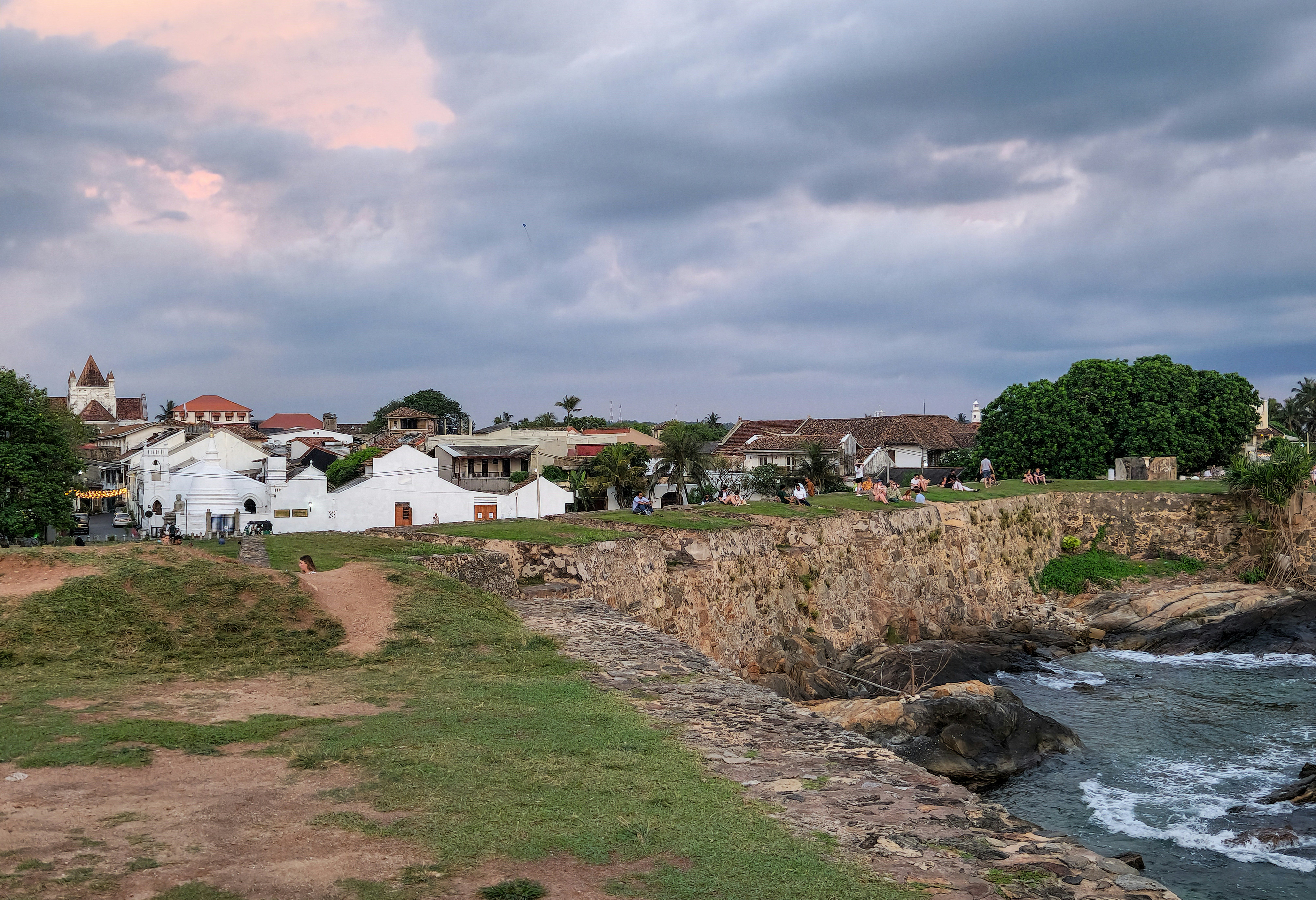 Coastal buildings sit beside the water.