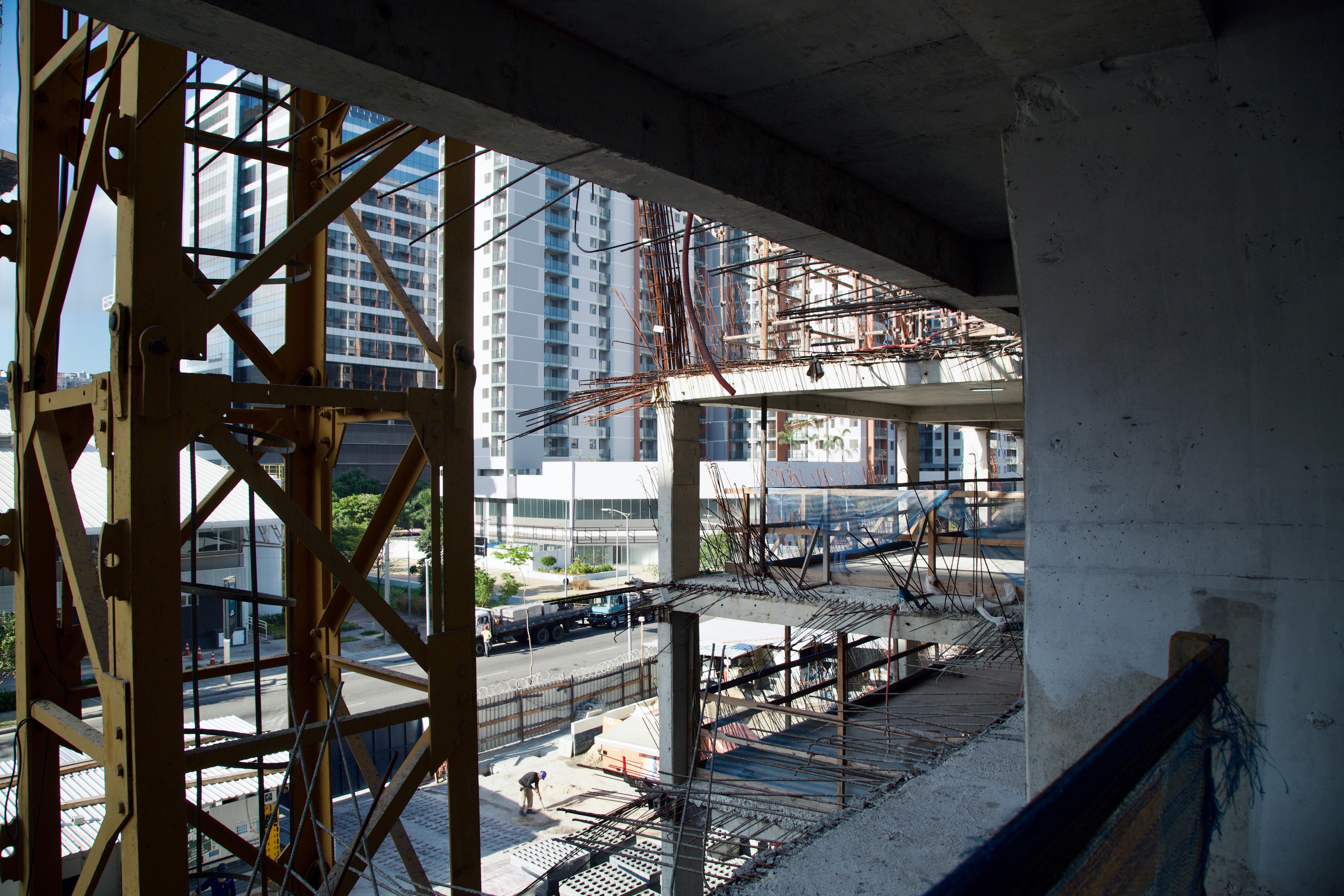 Construction site with unfinished buildings and cranes