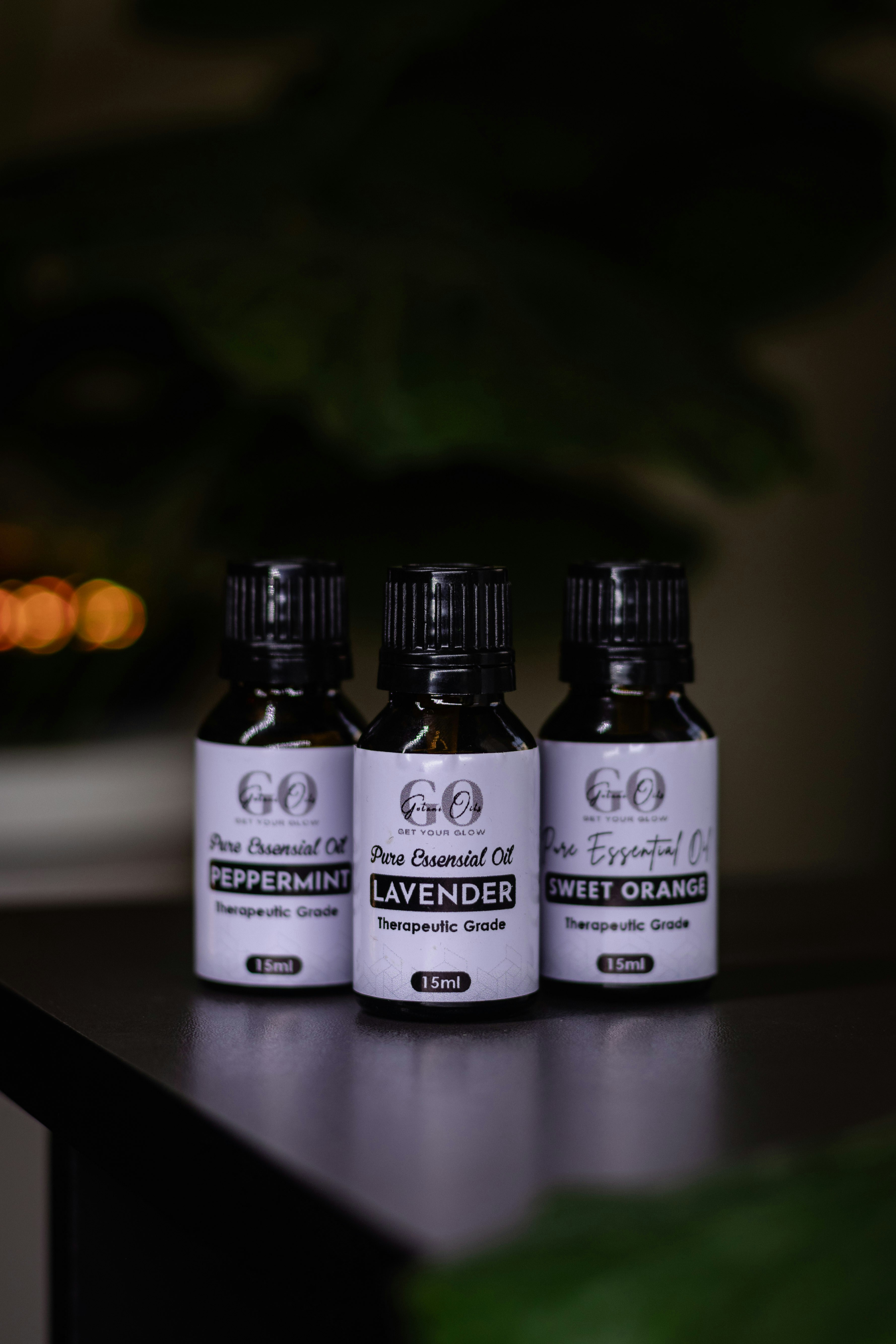 Three essential oil bottles are displayed.