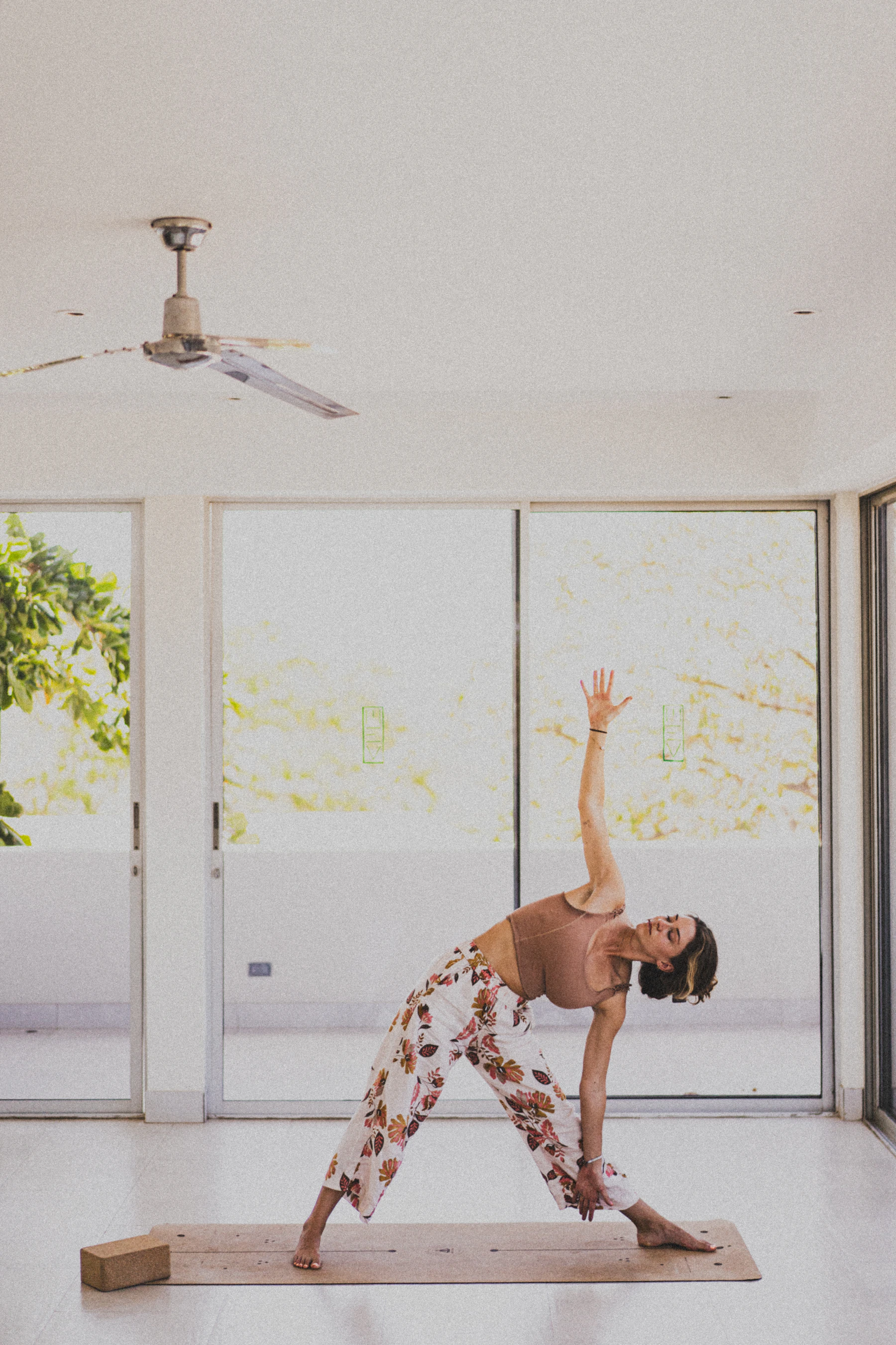 Woman wearing activewear in a bright movement studio
