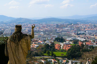 Statue gazes over a beautiful, sprawling city.