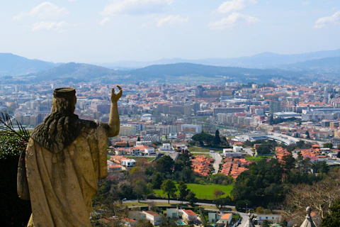 Statue gazes over a beautiful, sprawling city.