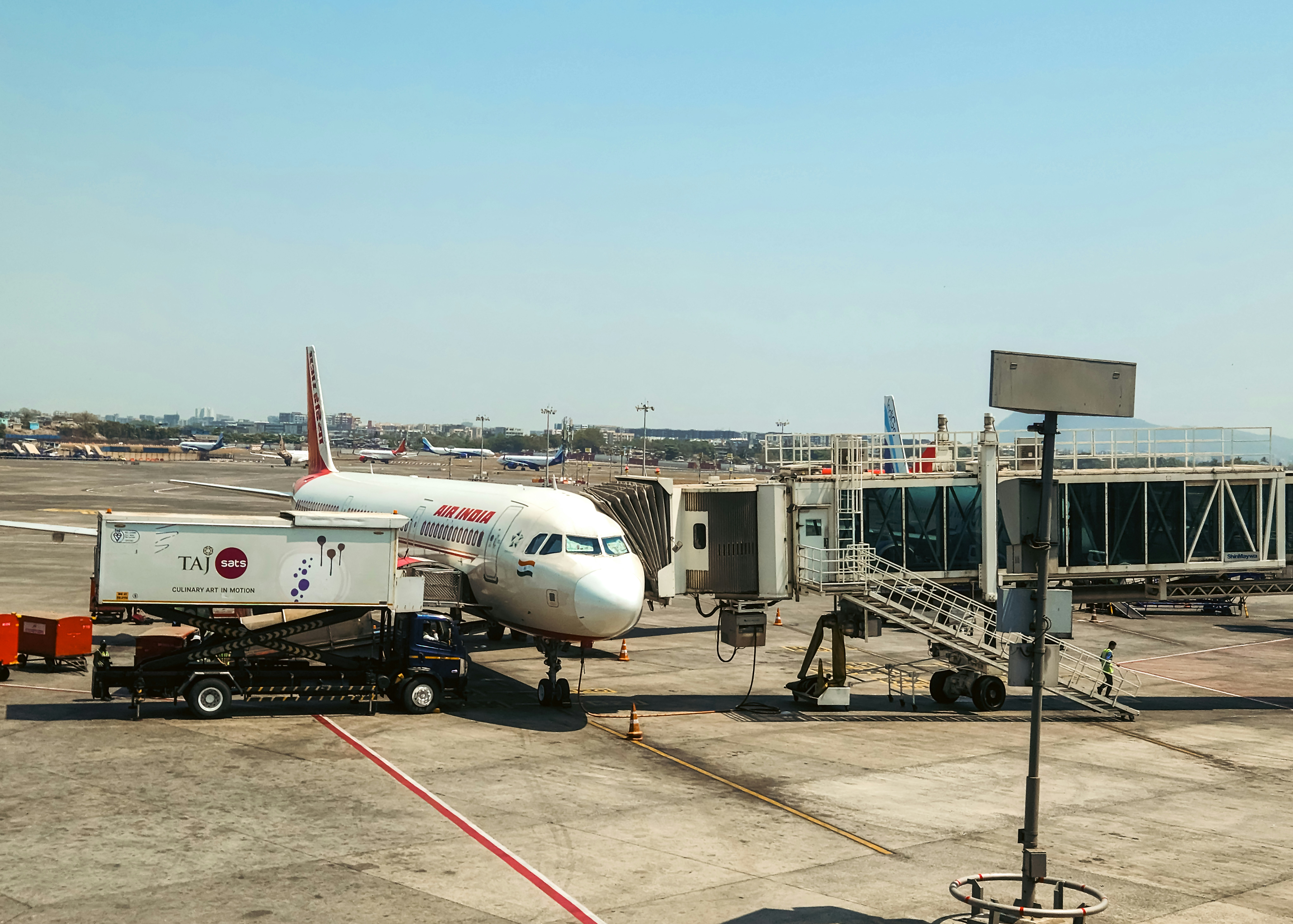 An airplane is connected to the jet bridge.
