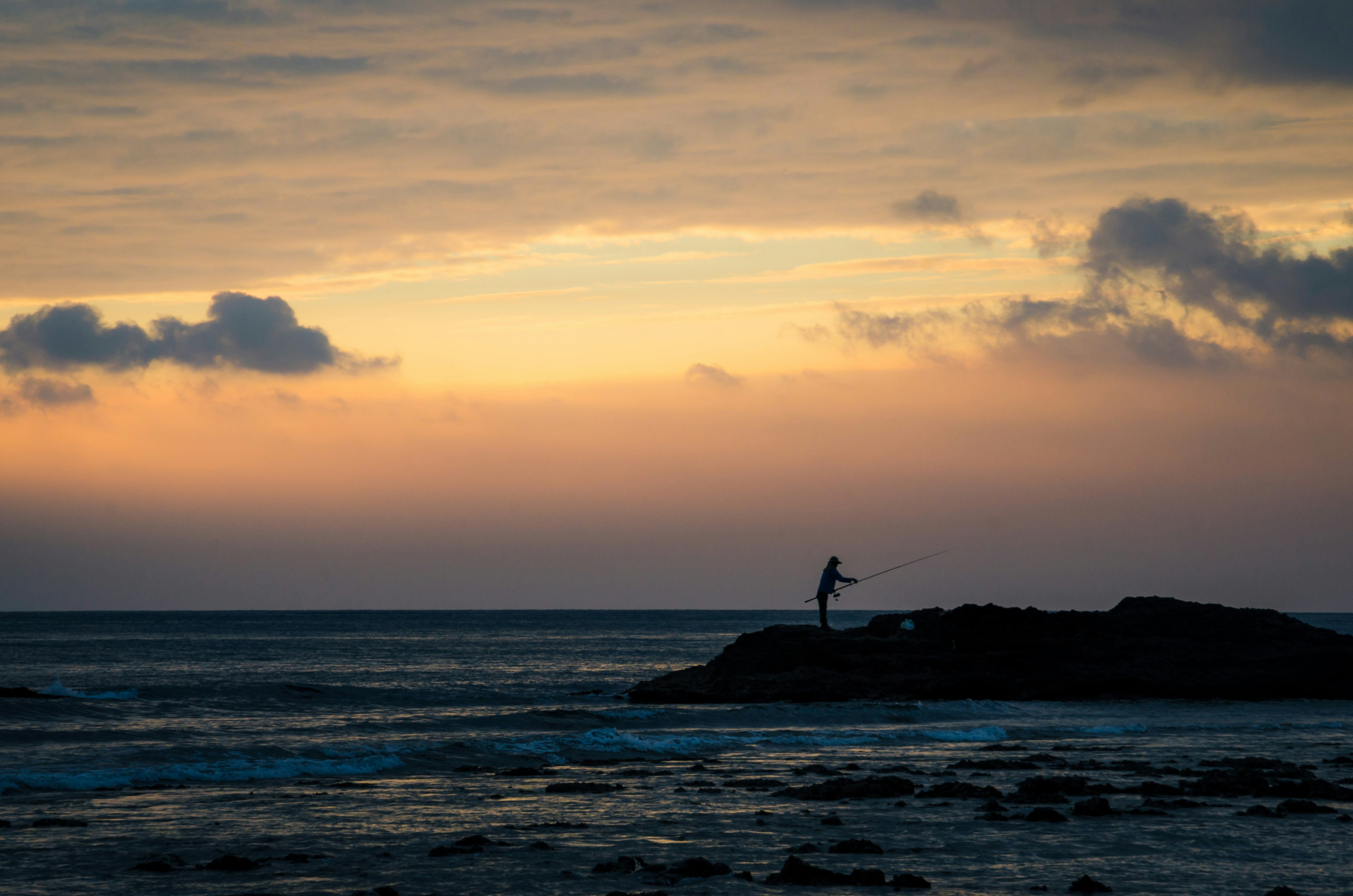 Rhythmic waves washing over a sandy shore.