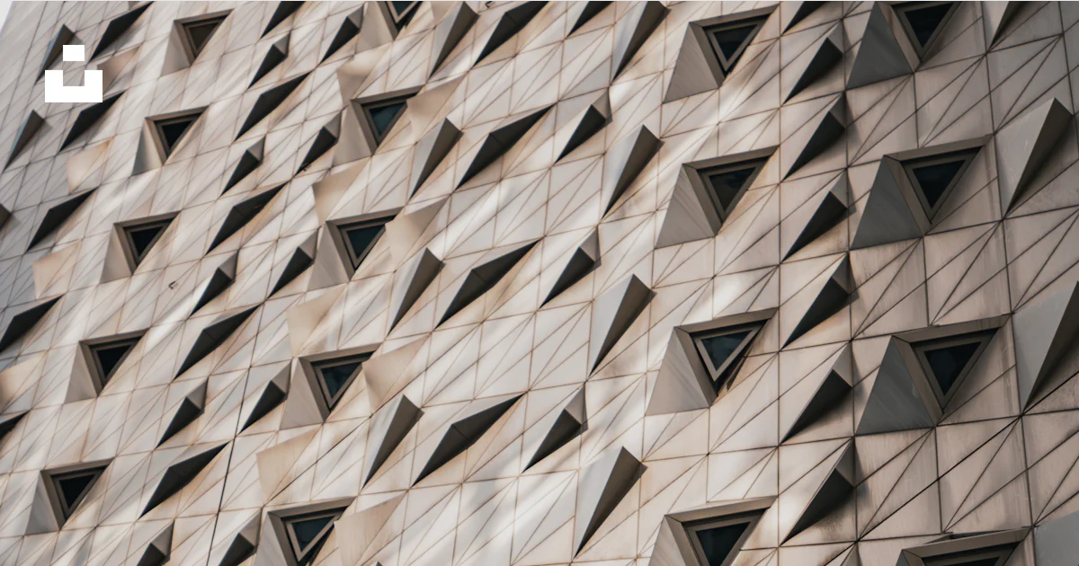 Random Triangular Facade A building facade with triangular designs. photo – Free Building Image ...