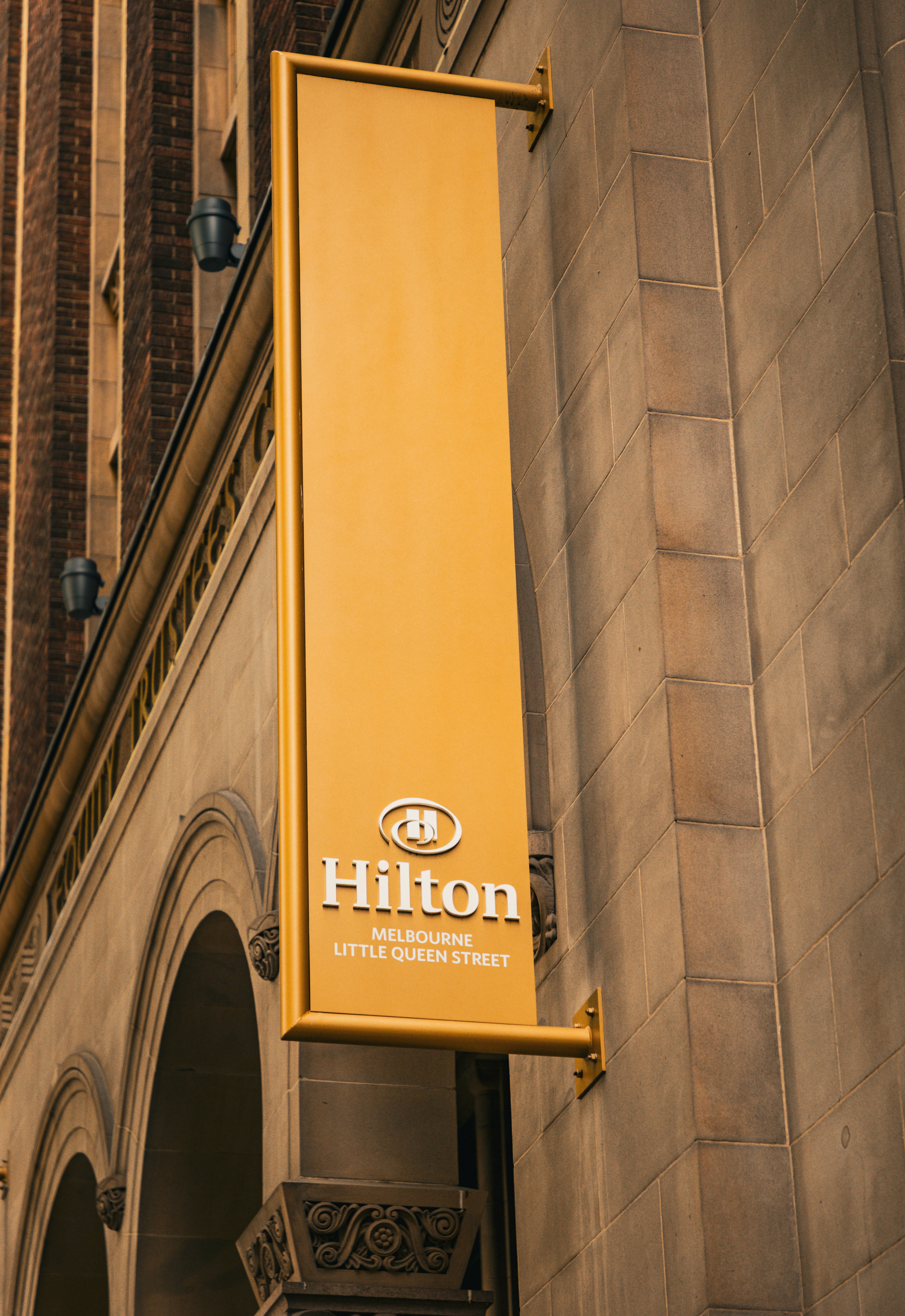 Hilton hotel sign displayed on a building's exterior. photo – Free ...