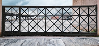 A metal gate with a diamond pattern.