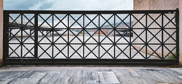 A metal gate with a diamond pattern.