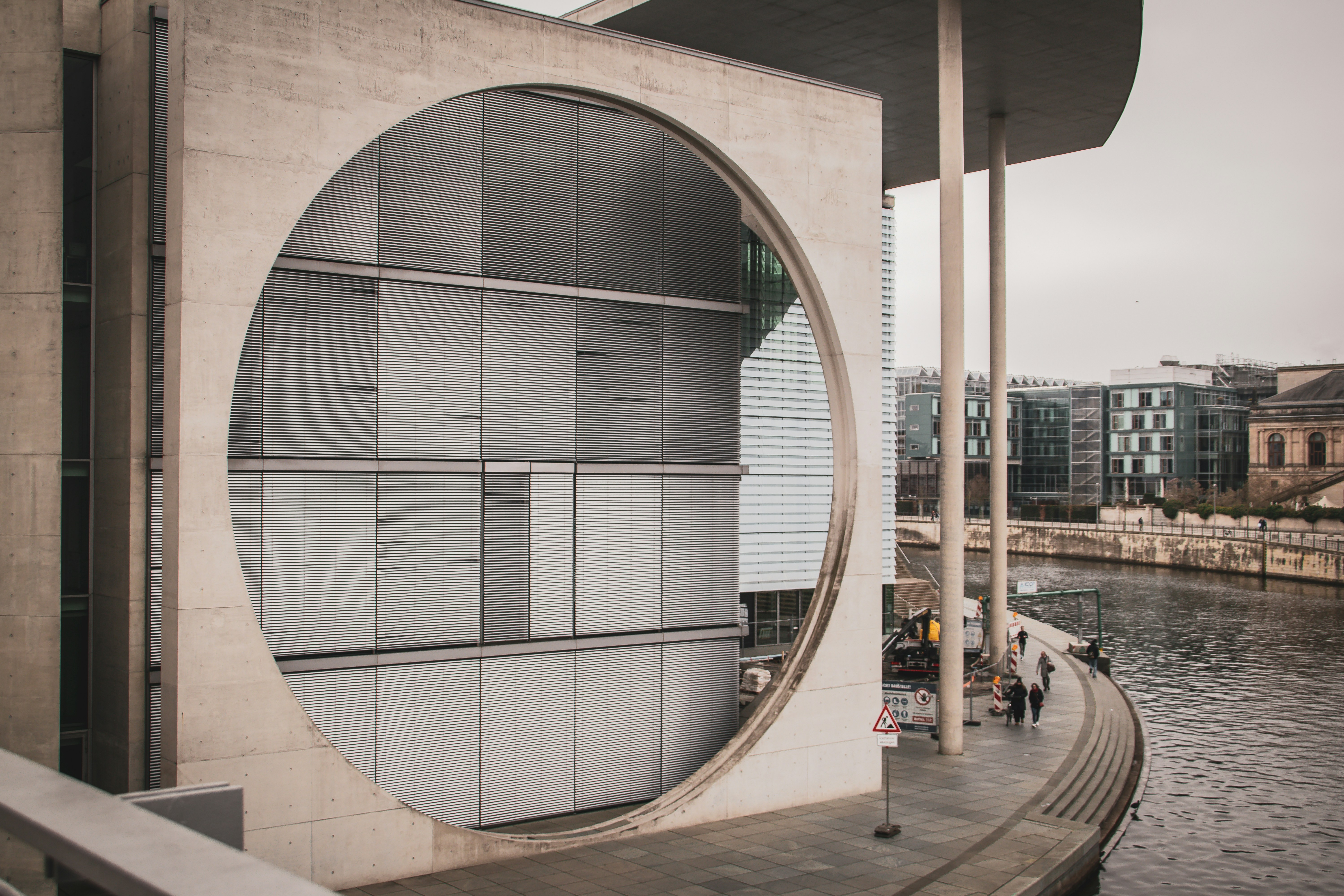 A modern building has a circular window opening. photo – Free Building ...