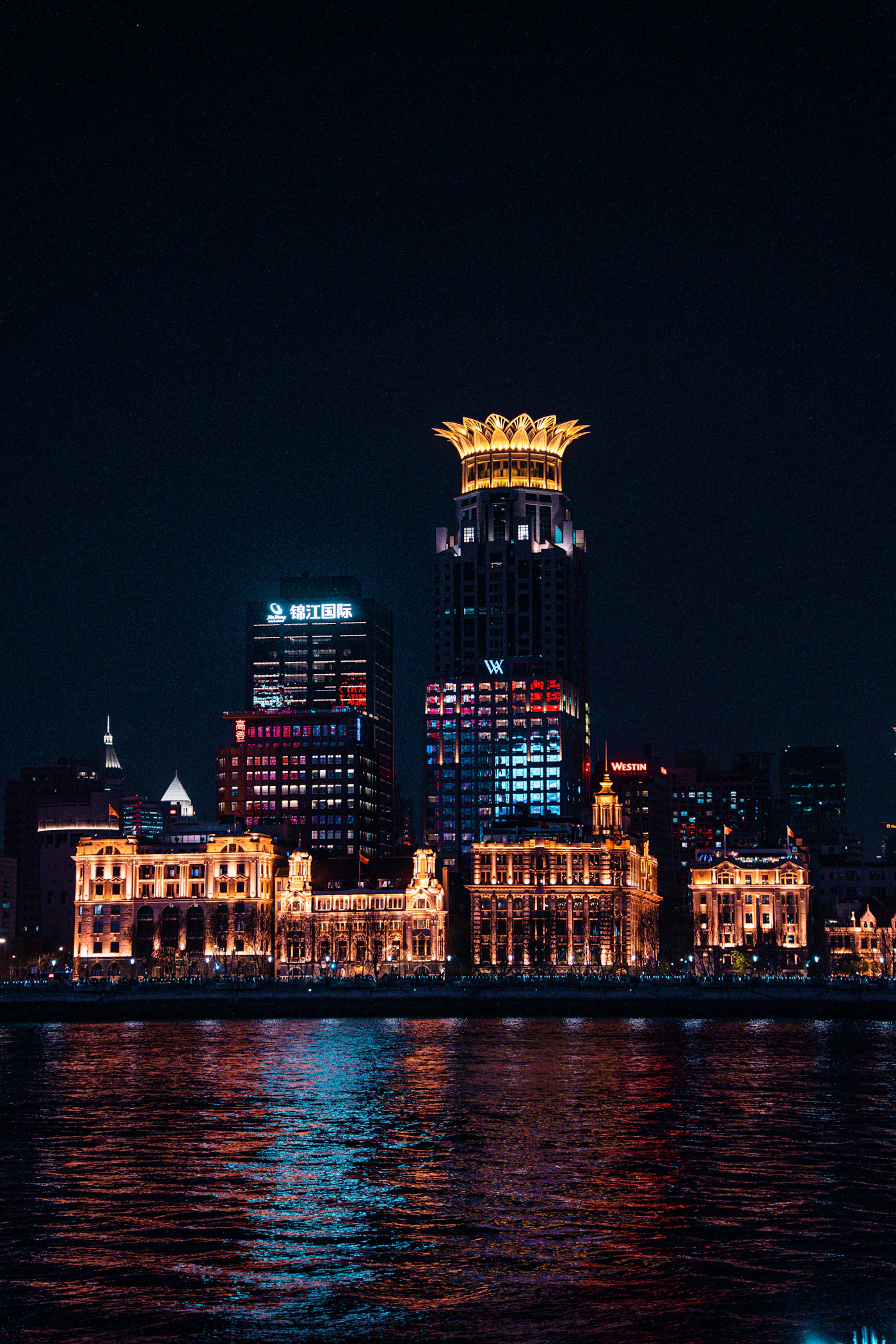 Modern Shanghai cityscape illuminated after dark, China