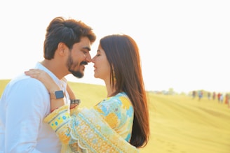 Couple shares a romantic moment nose to nose.