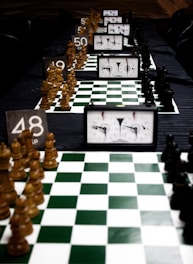 Chess boards with clocks are set for a tournament.