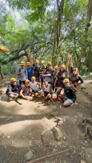 A group poses for a photo outdoors.