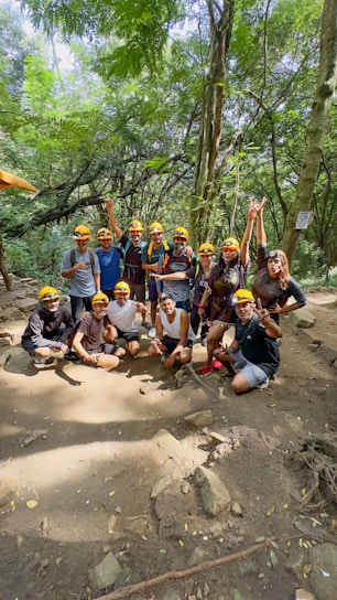 A group poses for a photo outdoors.