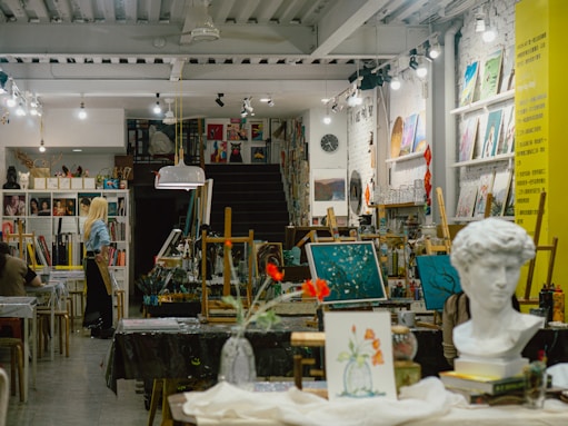 Art studio interior filled with easels and artwork.