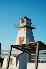 A lighthouse with a heart that says pei.