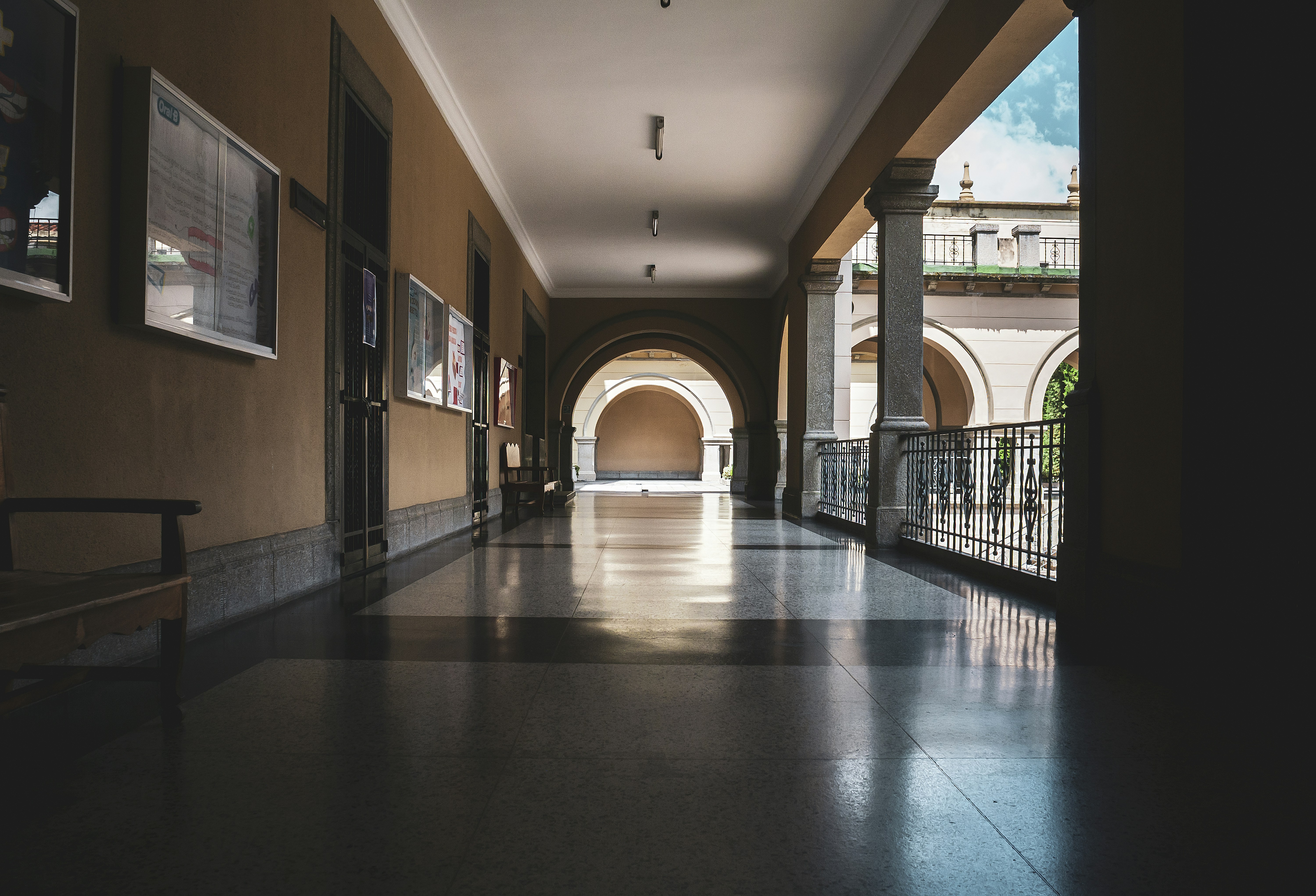 A long, well-lit hallway with a bright end.
