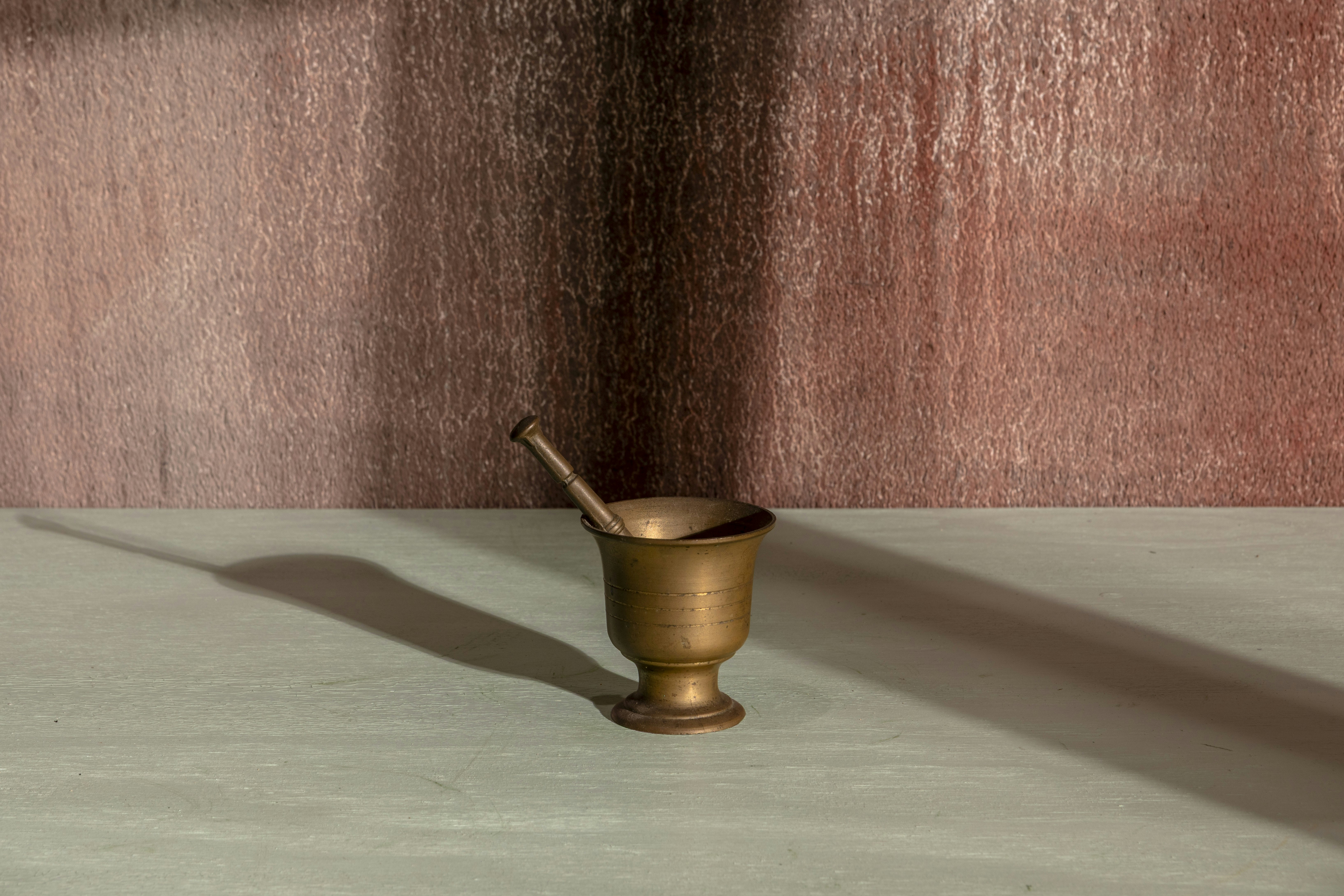 A mortar and pestle cast a long shadow.