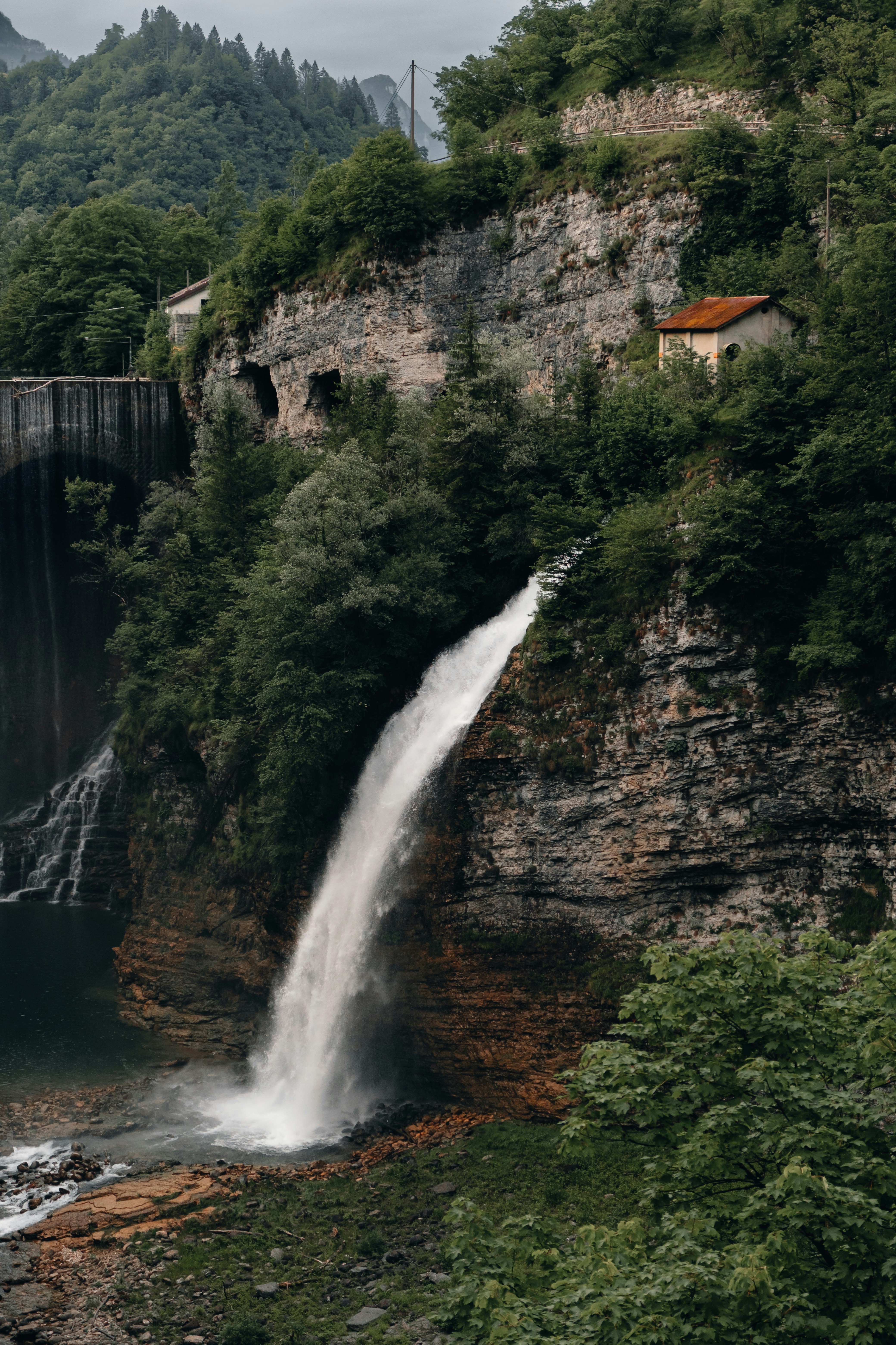 A waterfall cascades down a rocky cliff.