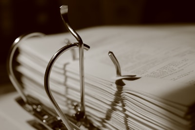 Binder clips hold stacks of papers.