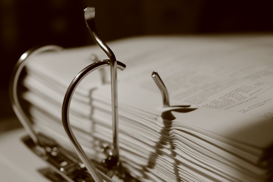 Binder clips hold stacks of papers.