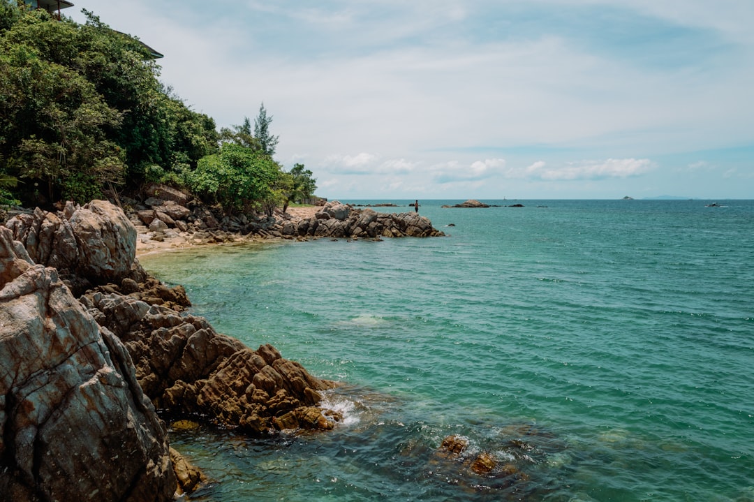 Rocky coastline meets the turquoise sea.