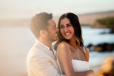 Happy couple embracing at the beach.