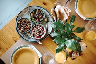 Delicious food is served on a wooden table.