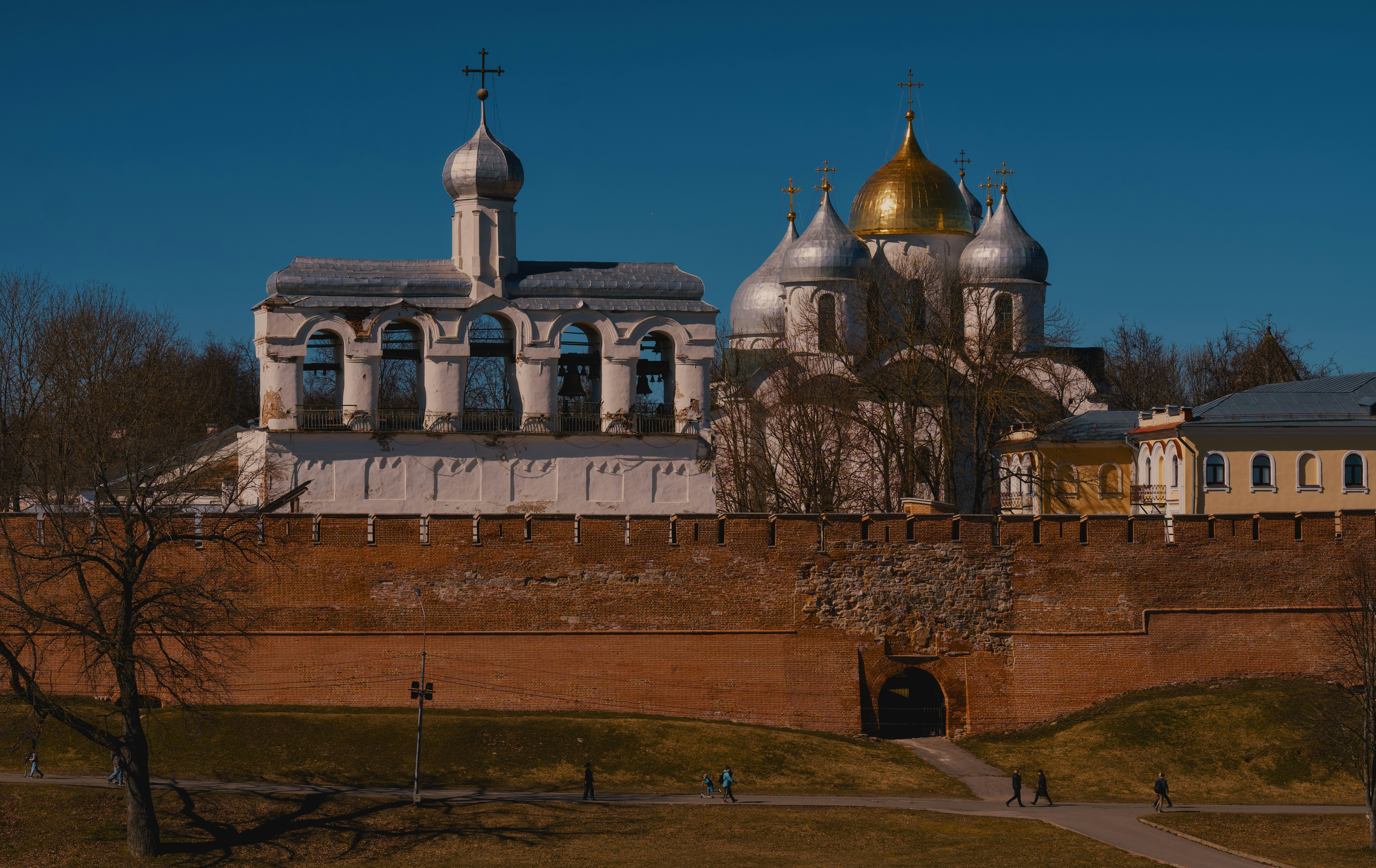 A fortress with domes and a brick wall.