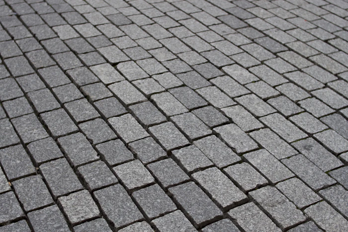Grey cobblestone paver walkway