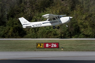 A small airplane takes off from the runway.