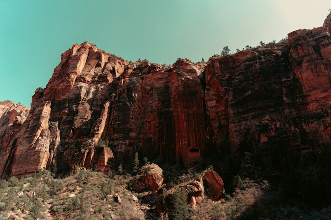 Red rock cliffs against a turquoise sky, the Red Rock Canyon backdrop behind Summerlin's high-end guard-gated communities