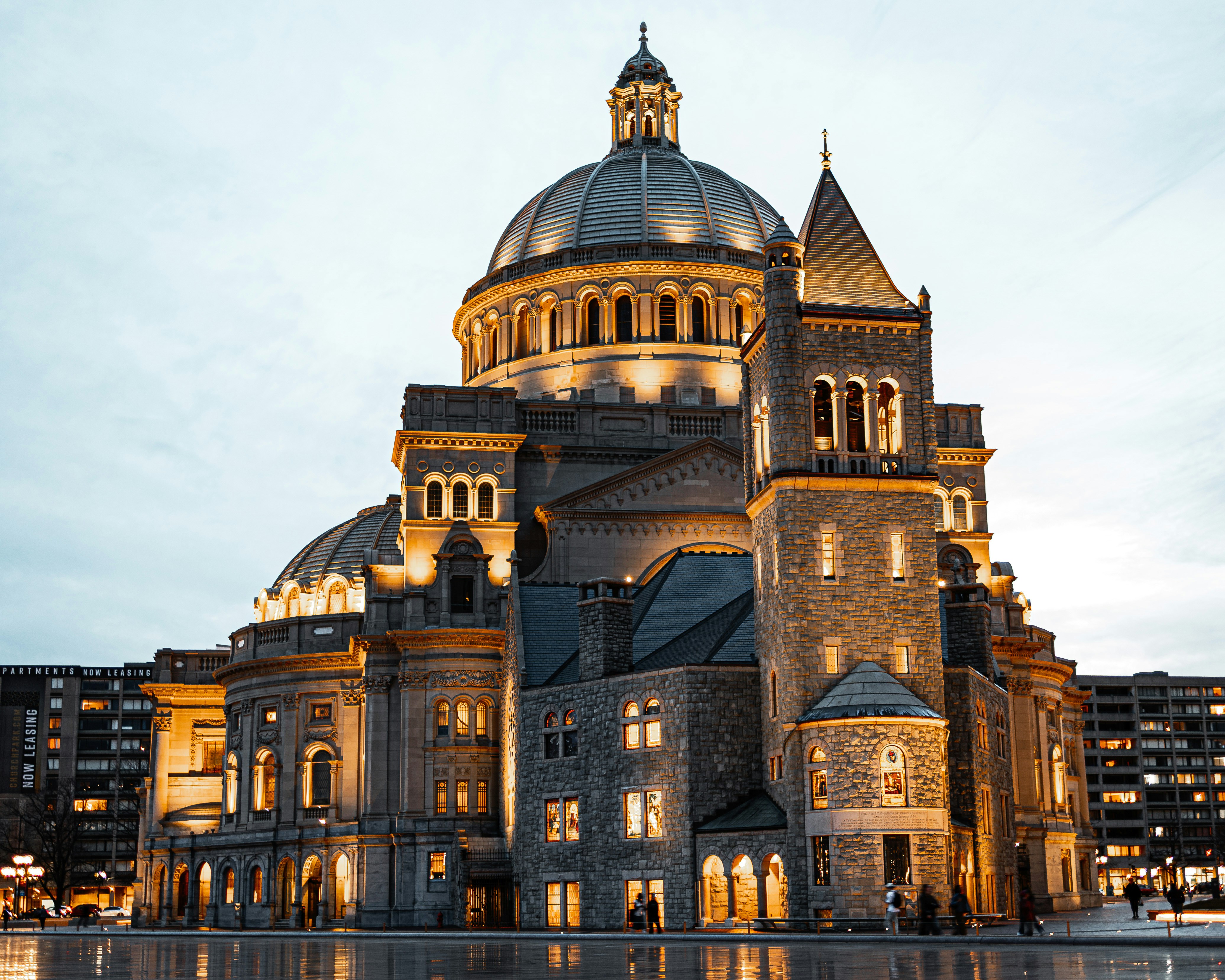 A large, illuminated church building stands tall