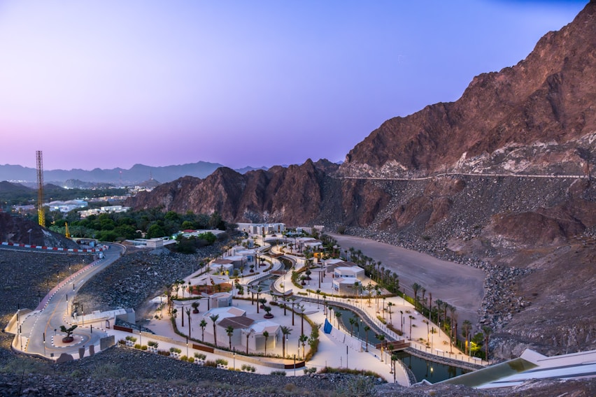 Scenic view of a park nestled beside mountains.