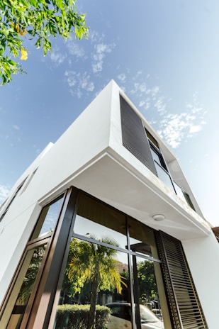 Modern white building against a beautiful, blue sky.